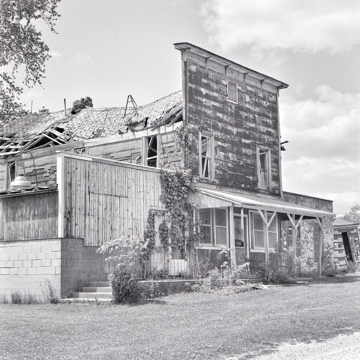 Weathered wooden storefront in black and white